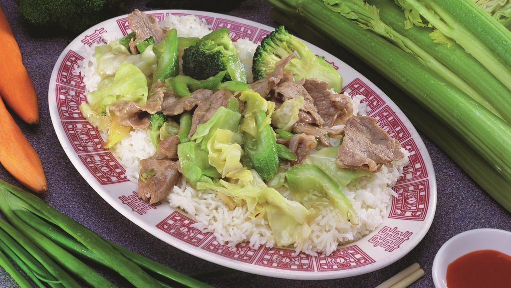 #26. Com Xao Thit Heo · Soy sauce pork over rice.
