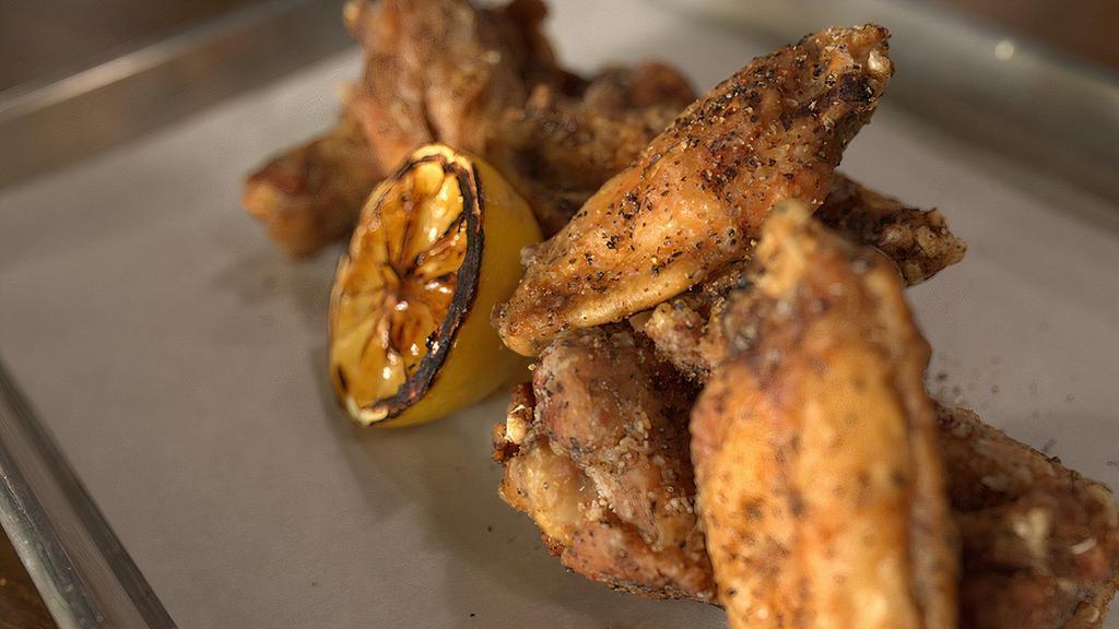 Lemon Pepper Wings · Mouth watering crispy wings with a yuzu aioli dipping sauce