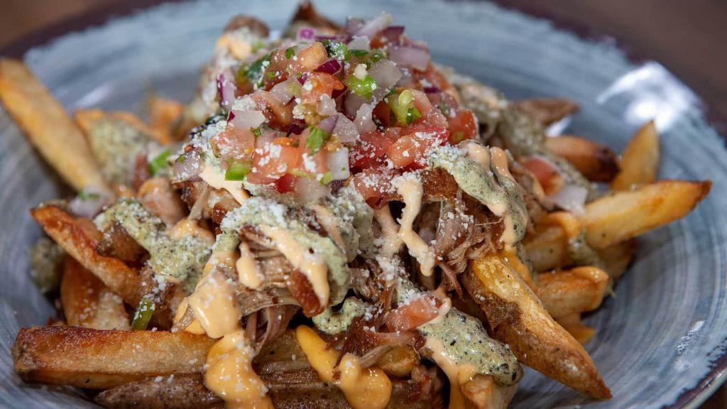 Carnitas Fries · French Fries Smothered In Pork Carnitas, Chipotle Crema, Salsa Verde, Cotija Cheese And Pico De Gallo