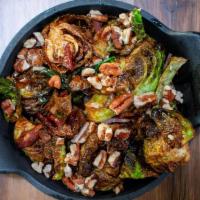 Brussel Sprouts · Crispy fried Brussel Sprouts tossed in Maple syrup, sherry vinaigrette and topped with bacon...