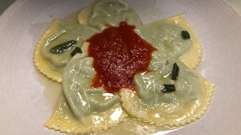 Ravioli · Ricotta and spinach filled ravioli, butter, sage and tomato sauce