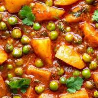 Aloo Mattar · Potatoes, peas cooked with homemade indian spcies and gravy.