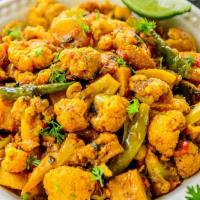 Aloo Gobi · Boiled potatoes, cooked cauliflower, Indian spices cooked with homemade tomato sauce.