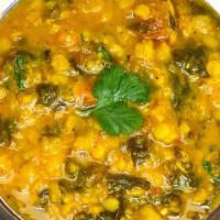 Palak Daal / Saag Daal · Yellow lentils, spinach, curry leaf cooked with Indian spices.