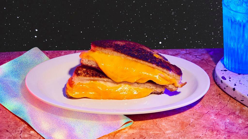 Grilled Cheese · Melted cheddar and american cheese, brioche bun.