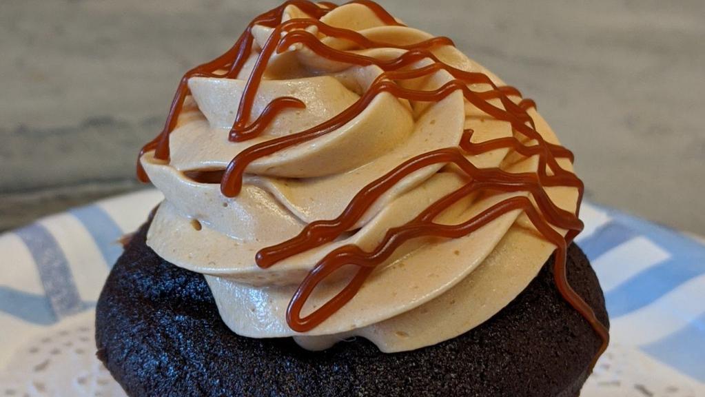 Salted Caramel Cupcake · If sweet and salty is your thing, this salted caramel cupcake will be your dream come true. Our moist chocolate cake is covered with caramel butter cream, caramel drizzle and sea salt.