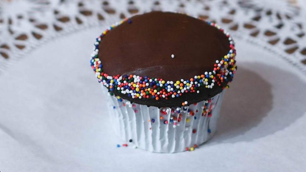 Chocolate Cupcake · Our chocolate cupcake is simple but delicious! It is a moist chocolate cake topped with fudge and sprinkles.