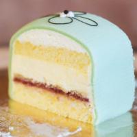 Swedish Princess Cake Slice · Our Swedish Princess is a light vanilla sponge cake with raspberry jam, custard, and whipped...