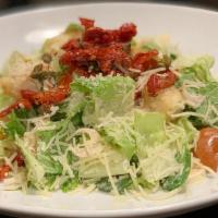 Small Caesar Salad · Romaine, Caesar dressing, hearts of palm, sun dried tomatoes, croutons, parmesan