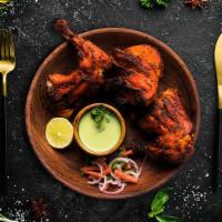 Chicken Tandoor · Bone-in chicken marinated in yogurt and house spices cooked to perfection in an Indian clay ...