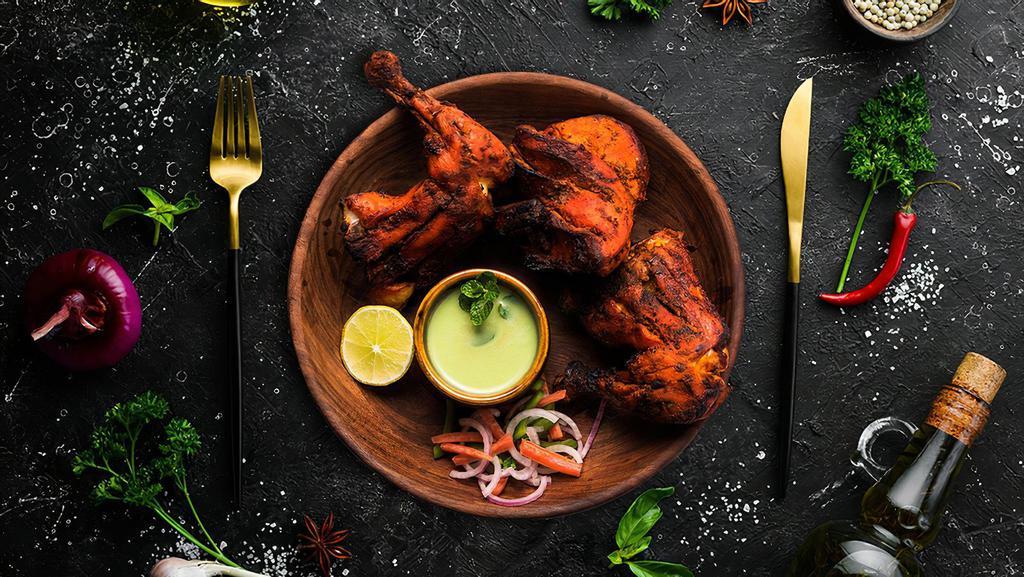 Chicken Tandoor · Bone-in chicken marinated in yogurt and house spices cooked to perfection in an Indian clay oven