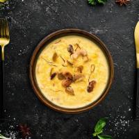 Classic Rice Pudding · Broken rice slow cooked in milk with dried fruits, nuts and cardamom till thick and creamy