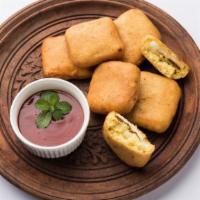 Paneer Pakoras · Indian cheese dipped in chickpea batter, ginger garlic and indian spices.
