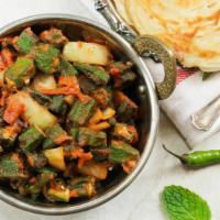 Vegan Okra Masala · Farmers market fresh okra marinated with onions, tomatoes, and indian spices.