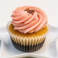 Neopolitan · Infused chocolate and vanilla cake topped with strawberry frosting.