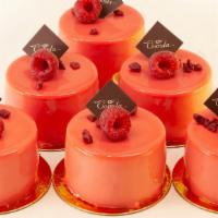 Baccara (Raspberry & White Chocolate Mousse) · Raspberry compote and spice cream on almond sponge and white chocolate mousse.