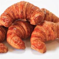 Croissant · Buttery flasky pastry in a crescent shape.