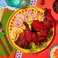 Tandoori Chicken · Chicken marinated with yogurt, ginger, garlic, and spices and char grilled in the tandoor gr...
