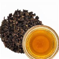 Roasted Oolong Tea · A full-bodied earthy oolong tea with a nutty and caramel-like profile.