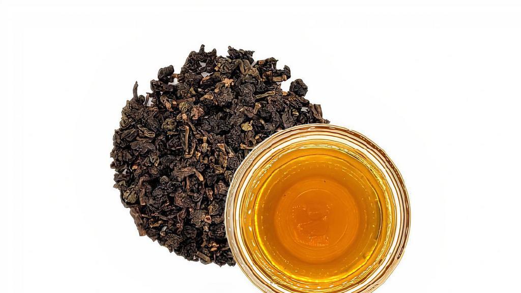 Roasted Oolong Tea · A full-bodied earthy oolong tea with a nutty and caramel-like profile.