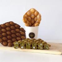 Mochi Egg Puff · Sweet and crispy bubble waffle filled with chewy mochi rice cakes.