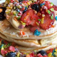 5. Cereal Pancakes · Fruity pebbles, corn pops, infused pancakes with cereal milk whip cream.