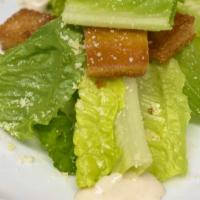 Cesar Salad · Chopped romaine lettuce with croutons and shredded parmesan cheese.