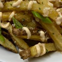 Firecracker Fries · House cut fries topped with green onions and garlic parmesan.