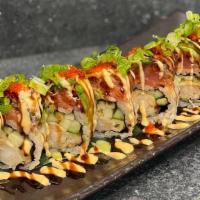 Red Dragon · Shrimp tempura, cucumber topped with spicy tuna, unagi, avocado, unagi sauce, tobiko, and gr...