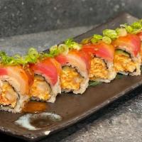 Candy Cane Roll · Shrimp tempura, spicy imitation crab, cucumber, topped with hamachi, tuna, spicy garlic ponz...