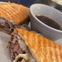 Tri Tip Dip · Thinly sliced grilled tri tip warmed in au jus on a French torpedo roll with horseradish, ho...