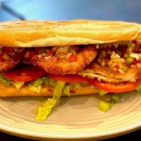 Chicken Milanese · Hand breaded chicken with shredded lettuce, sliced tomato, house mayo, and salsa criolla on ...