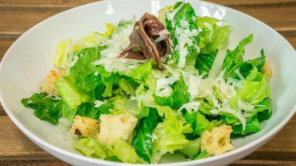 Caesar Salad · Organic romaine heart, parmesan cheese, house-made croutons and anchovies with Caesar dressing.