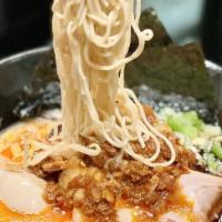 Karaka Spicy Ramen · The original tonkotsu pork broth with an added kick, thin noodles toped with our special ble...