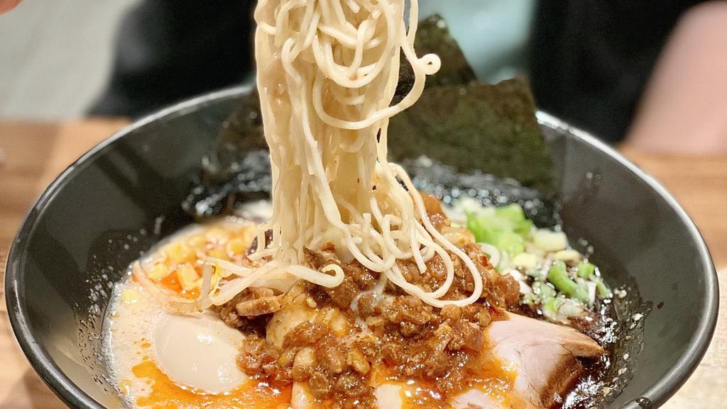 Karaka Spicy Ramen · The original tonkotsu pork broth with an added kick, thin noodles toped with our special blend of hot spices, fragrant garlic oil, pork belly chashu, bean sprouts, kikurage mushrooms and scallions. Suggested toppings: Onsen tamago, corn.