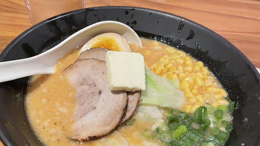 Miso Tonkotsu · Rich and creamy miso-flavored original tonkotsu pork broth, topped with bean sprouts, scallions, cabbage, corn, butter and pork belly chashu.
