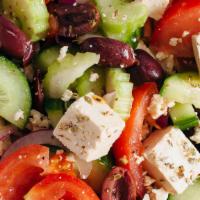 Greek Salad · Mixed greens, tomatoes, cucumbers, onions, olives, topped with feta cheese and dressing.