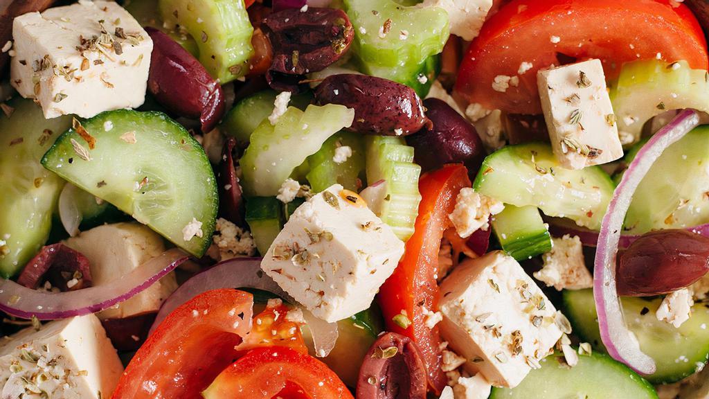 Greek Salad · Mixed greens, tomatoes, cucumbers, onions, olives, topped with feta cheese and dressing.