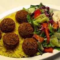 Falafel plate · Authentic traditional,3 pieces falafel over rice,baba ganoush ,cucumber tomato salad,pita br...