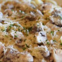 Italian Sausage Fettuccine · Tossed with mushrooms in our garlic cream sauce.