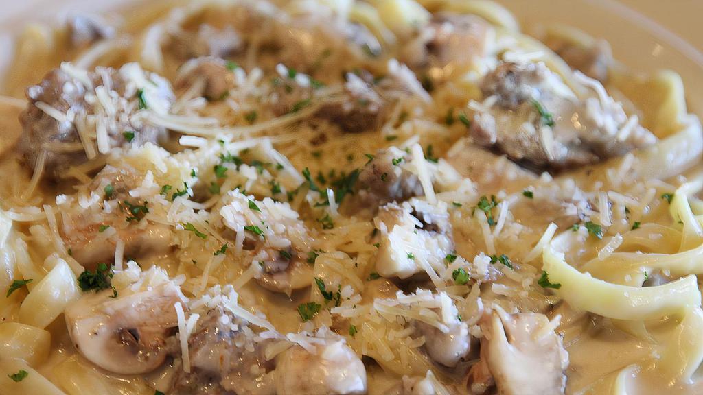 Italian Sausage Fettuccine · Tossed with mushrooms in our garlic cream sauce.