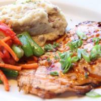 Wood Grilled Salmon · Wood grilled with your choice of topping. Served with roasted garlic mashed potatoes and pan...