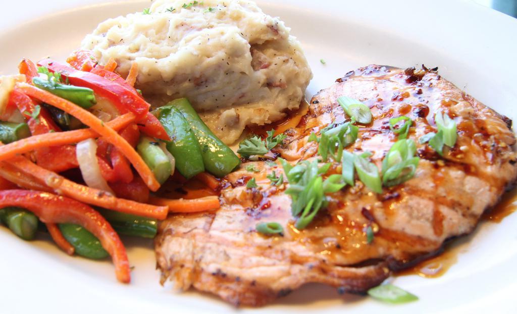 Wood Grilled Salmon · Wood grilled with your choice of topping. Served with roasted garlic mashed potatoes and pan roasted veggies.