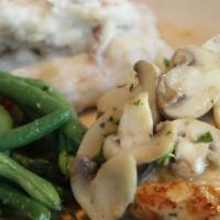 Wood Grilled Chicken · Marinated and grilled with sautéed mushrooms. Served with roasted garlic mashed potatoes and...