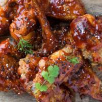Cajun Fried Chicken Wings · Golden-crispy fried chicken wings dipped in tangy cajun sauce.