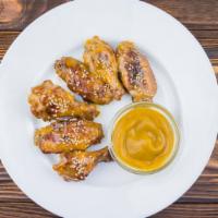 Honey Mustard Fried Chicken Wings · Golden-crispy fried chicken wings dipped in sweet honey mustard sauce.