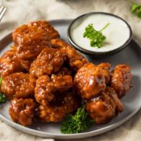 Sweet BBQ Fried Chicken Wings · Golden-crispy fried chicken wings dipped in sweet BBQ sauce.