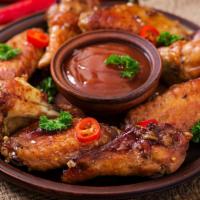 Sweet & Sour Chicken Wings · Golden-crispy fried chicken wings dipped in sweet and sour sauce.
