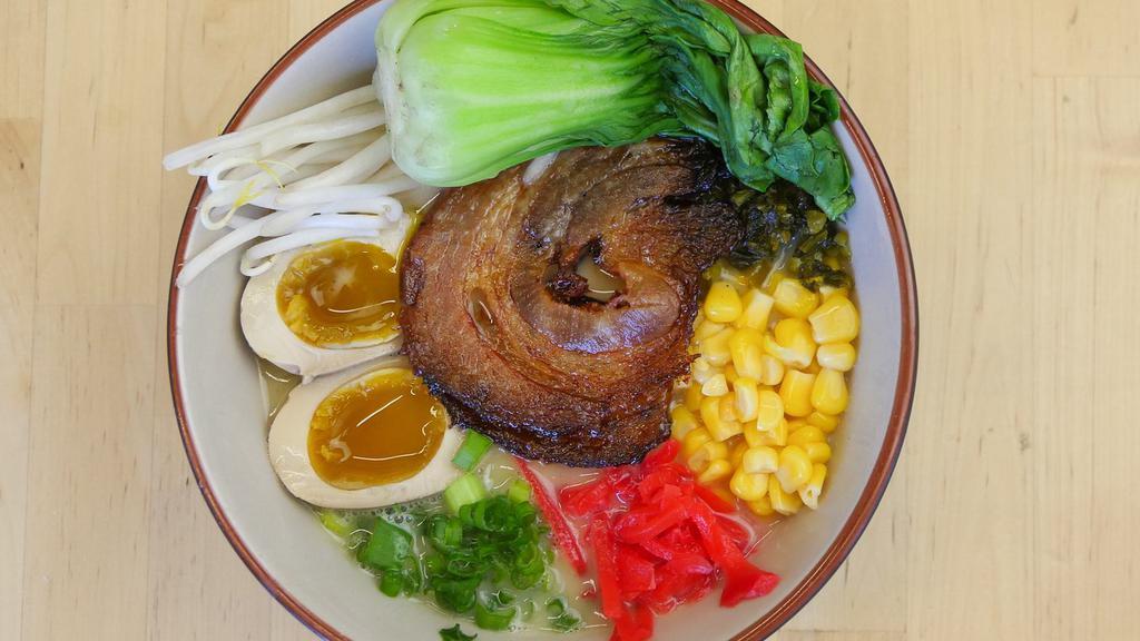 Miso Ramen with Chashu · Hearty miso broth served with corn, butter, scallions, ginger, horenso, soy-marinated egg, chashu and thick noodles. Contains the following: gluten, eggs, soy, and sesame.