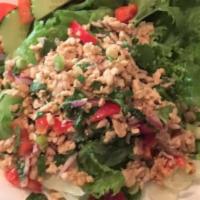 Larb · Ground chicken spiced with mint, red onions, red bell pepper and scallions.